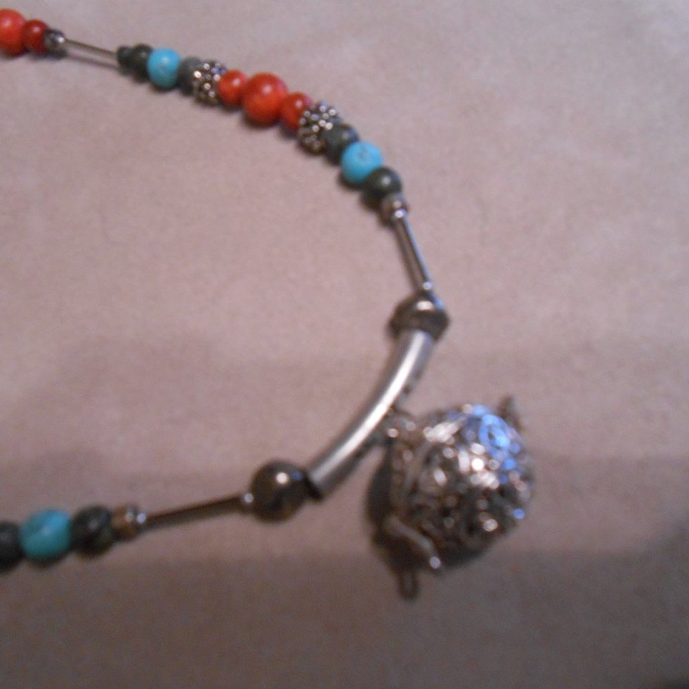 Women’s new Turquoise, Coral and Silver necklace with silver prayer ball.